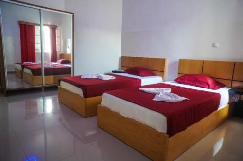 Un pat sau paturi într-o cameră la Hotel 3M Tours