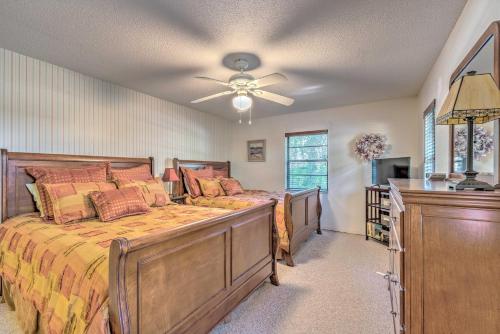 a bedroom with a bed and a ceiling fan at Private Dock Canal-Front Homosassa Home! in Homosassa