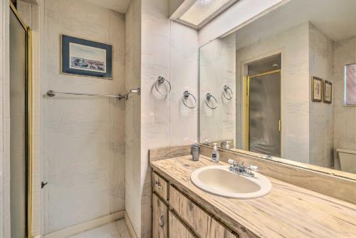 a bathroom with a sink and a mirror at Private Dock Canal-Front Homosassa Home! in Homosassa