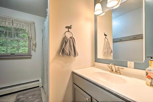 A bathroom at Rustic Adirondacks Home with Hot Tub and Lake Access!