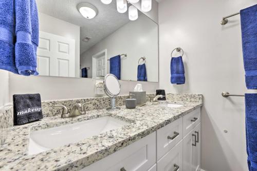 a bathroom with a sink and a mirror at Charming Southern Pines Abode - Walk to Dtwn! in Southern Pines