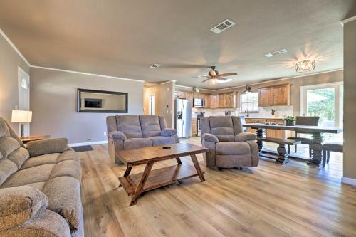 a living room with a couch and chairs and a table at Quiet Haven with Hot Tub, 4 Mi to Canyon Lake! in Fischer