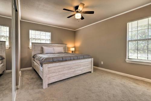 a bedroom with a bed and a ceiling fan at Quiet Haven with Hot Tub, 4 Mi to Canyon Lake! in Fischer