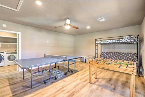 a ping pong room with two ping pong tables at Quiet Haven with Hot Tub, 4 Mi to Canyon Lake! in Fischer