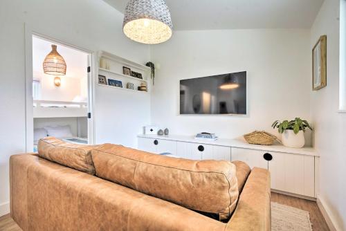 a couch in a living room with a tv at Chic and Central Ventura Home - Walk to Beach! in Ventura