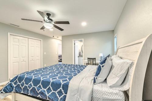 a bedroom with a bed and a ceiling fan at Remodeled Family Home with Patio - Walk to UF! in Gainesville