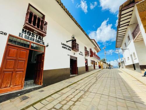 a cobblestone street in a town with buildings at Hostal El Gran Gocta in Chachapoyas
