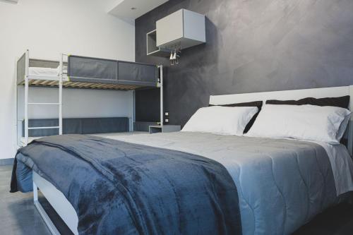 a bedroom with a bed and a bunk bed at Amica geniale in Naples