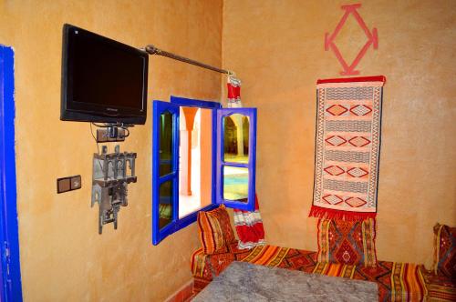 TV a/nebo společenská místnost v ubytování Auberge Les Roches