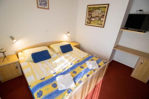 Ένα ή περισσότερα κρεβάτια σε δωμάτιο στο Rooms Cvitar - Center