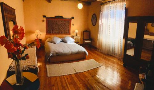 מיטה או מיטות בחדר ב-CASA DEOGRACIAS