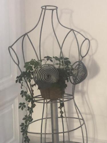 a metal flower basket with a plant in it at 3DALIPHARD in Rouen