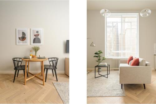 a living room with a table and a couch at Museum Apartments in Edinburgh