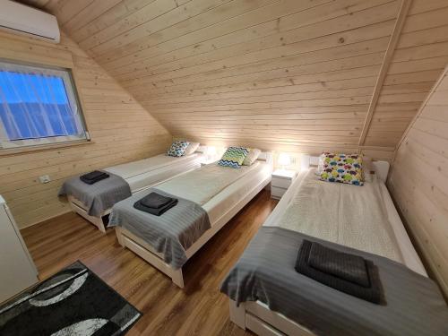 Ένα ή περισσότερα κρεβάτια σε δωμάτιο στο Słoneczny Zakątek