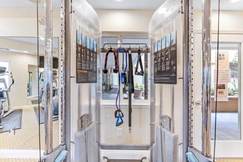 a row of gym machines with their doors open at Balmoral in Santa Clara