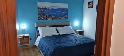 A bed or beds in a room at Napoli Blu Gardenia B&B