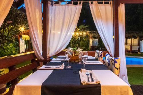 a table set up for a meal at a restaurant at Namuwoki Lodge in Puerto Viejo