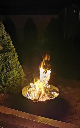 a skateboard on fire in a yard at night at DWIE DAMY Na Gwizdówce 8 in Załakowo