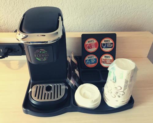 a black lunch box with a coffee maker and cups at Amanzi Hotel, an Ascend Collection Hotel in Ventura