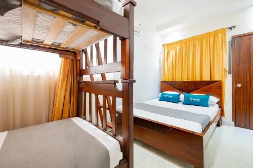 A bed or beds in a room at Ayenda Victoria Comfort