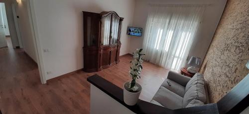 a living room with a couch and a table at Casa Al Lago in Bolsena
