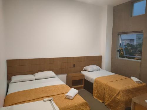 En eller flere senge i et værelse på HOTEL BOUTIQUE PANAMÁ