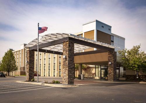 a building with an american flag in front of it at Best Western Plus Strongsville Cleveland in Strongsville