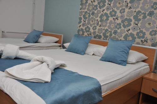 Postel nebo postele na pokoji v ubytování Garni Hotel Laguna Lux