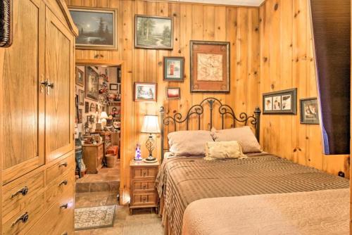 a bedroom with a bed and a wooden wall at La Villa By The Riverwalk in San Antonio