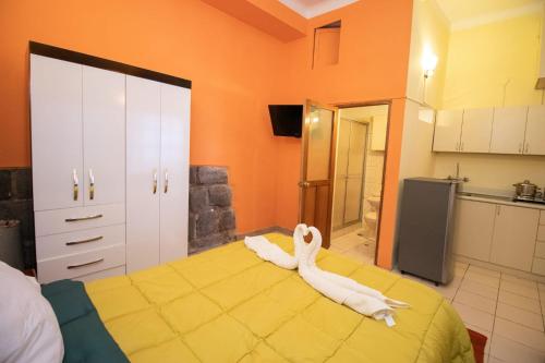 Llit o llits en una habitació de Apartment in the Plaza de Armas Cusco