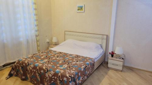 Кровать или кровати в номере LV Apartments
