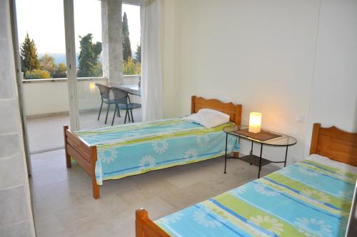 Postel nebo postele na pokoji v ubytování House Lemoni, Apartment C - Pelekas, Corfu
