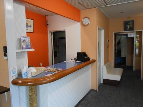 a waiting area of a hospital with a phone at Kakegawa Station Hotel in Kakegawa