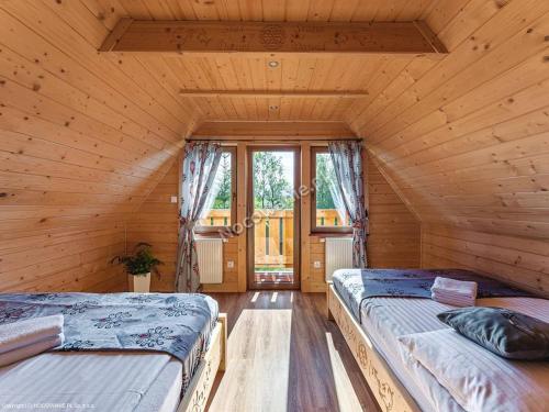 Postel nebo postele na pokoji v ubytování Domek Góralski Zębianski Dworek