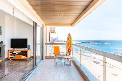 a balcony with a view of the ocean at Povoa Sunset Views in Póvoa de Varzim
