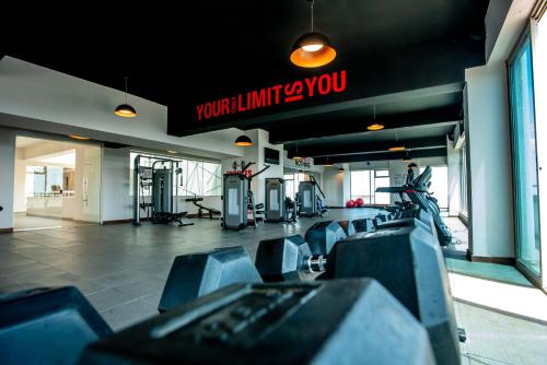 a gym with chairs and a sign that reads you wont kill yourself at Skynest Residences by CityBlue, Nairobi Westlands in Nairobi
