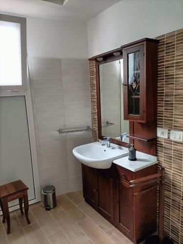 a bathroom with a sink and a mirror at Luxury B&B Iolanda in Catania