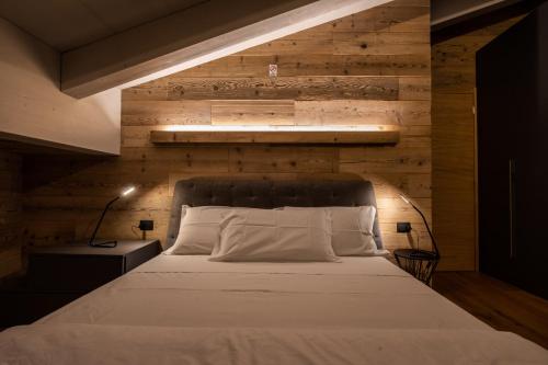 En eller flere senge i et værelse på CASA VACANZE RANUNCOLO 6