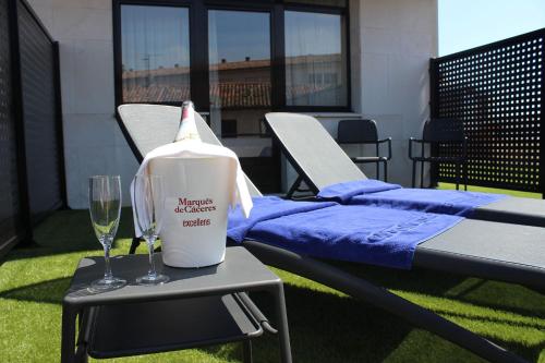 a bottle of milk sitting on a table with a glass at Montemar in Llanes