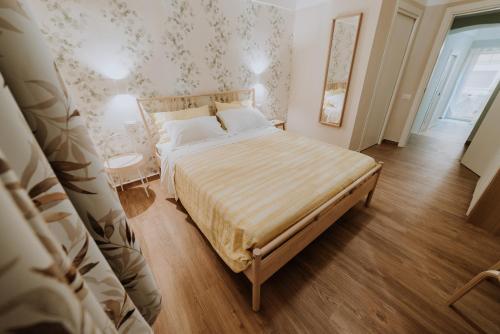 a bedroom with a large bed in a room at La casa di Achille in Chieti