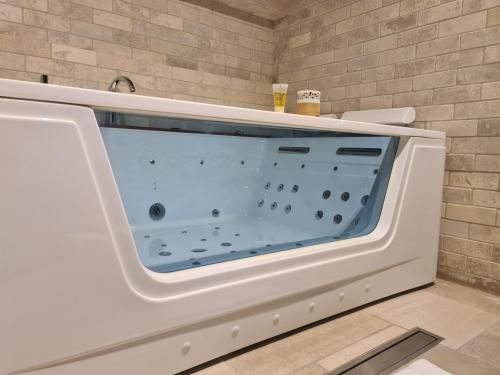 a white microwave oven sitting in a bathroom at סוויטת נור Noor Suite in Majdal Shams