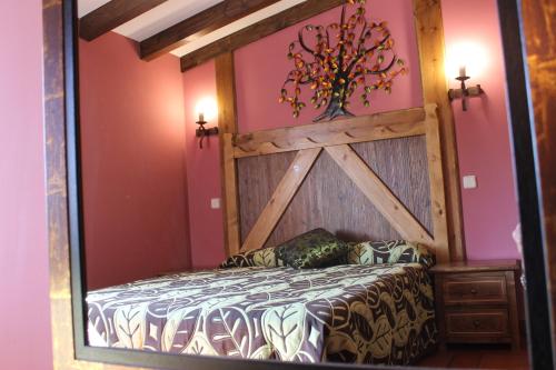 Cama o camas de una habitación en Apartamentos Rurales "La Cabaña"