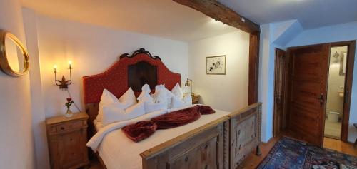 Un pat sau paturi într-o cameră la ArkadenSchlössl