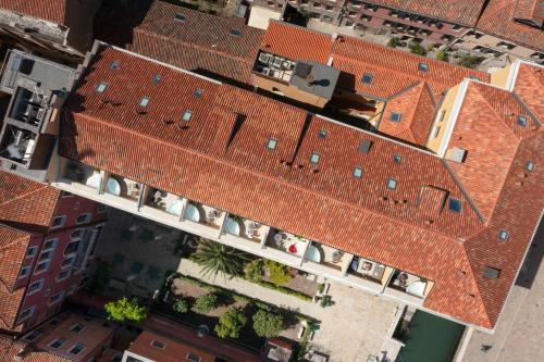 an overhead view of a building with red roofs at Palazzo Veneziano - Venice Collection in Venice