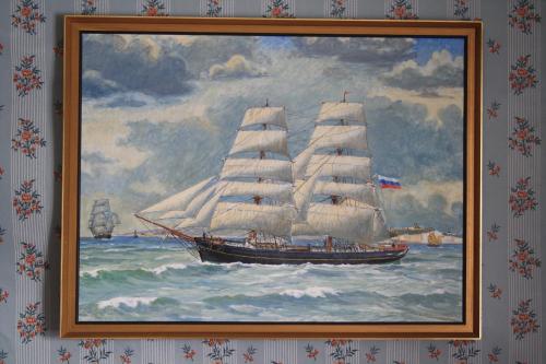 a painting of a sail boat in the water at Hotel Stallbacken Nagu in Nauvo