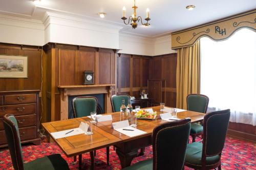 a conference room with a wooden table and chairs at Best Western Red Lion Hotel in Salisbury