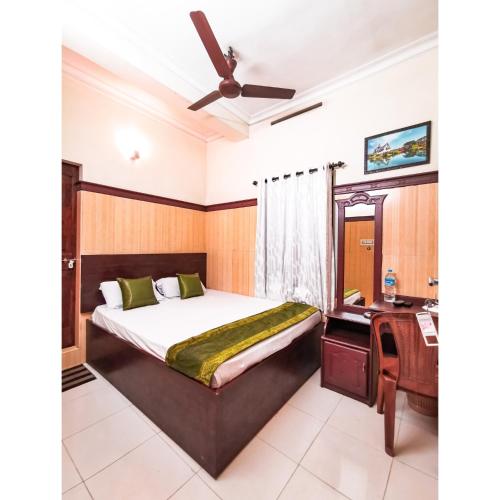 Кровать или кровати в номере New AS Tourist Home Aluva