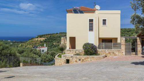 a house on the side of a hill at Margarita's Villas in Chania Town