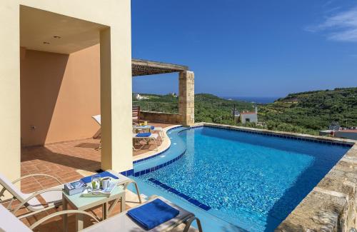 a swimming pool in a villa with a view at Margarita's Villas in Chania Town