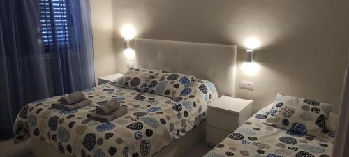 A bed or beds in a room at Relax in Puerto del Carmen